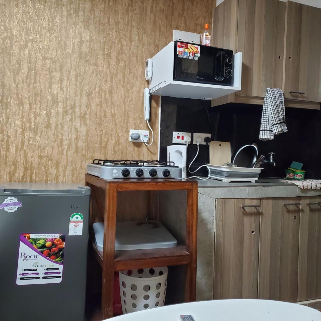 Lovely & Cozy Compact Studio Near Airport With Rooftop View Apartment Найроби Екстериор снимка